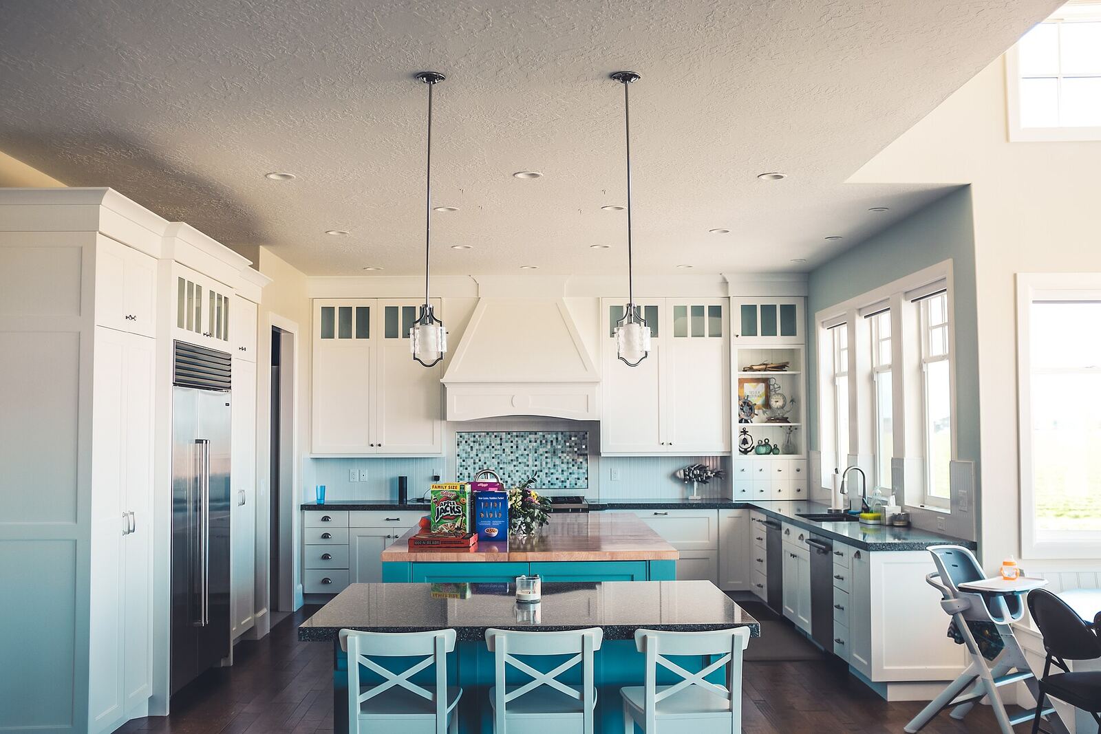 Bright white kitchen with a large island and bar seating